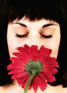 Woman Smelling green aromas how to clean a bathroom